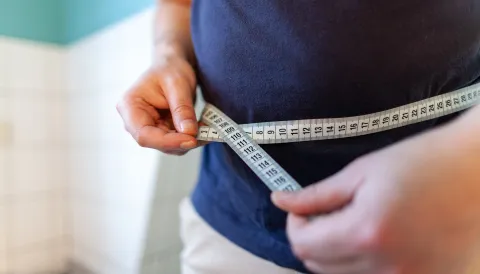 A Person is measuring his abdominal size