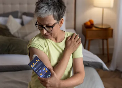 a woman checking her glucose levels