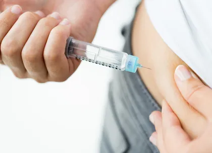 A women taking diabetic medicine